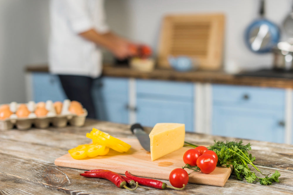 Cozy, personalized kitchen filled with unique, custom-designed kitchen items such as engraved wooden spoons, colorful, patterned ceramic dishes, and monogrammed linen towels, artfully displayed in a r