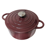 Vinröd gryta av gjutjärn med emaljerad insida
