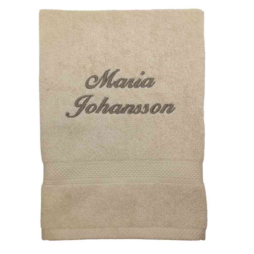 Handduk kursiv text, sandfärgad